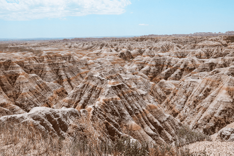 image of badlands national park featuring terracotta colored rock