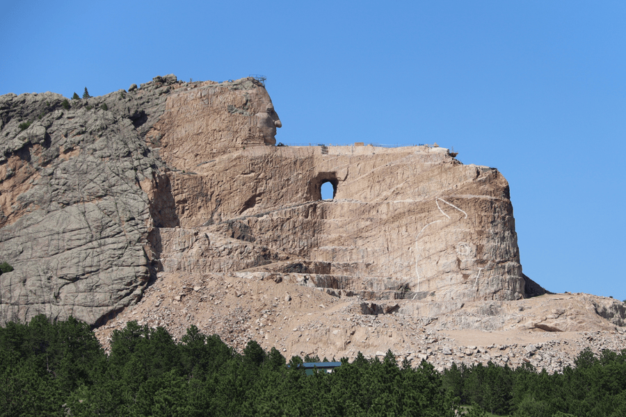side view of Native American sculpture in mountain