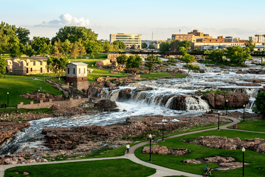 overlook of a park and city featuring a waterfall and tower in South Dakota